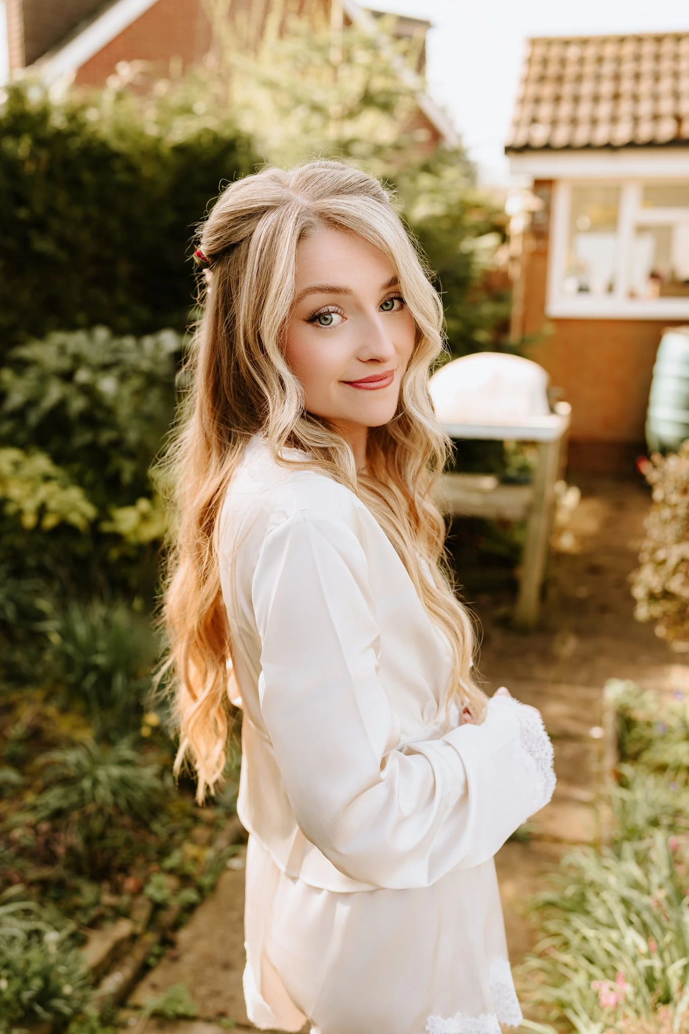 Grace & Mikey bridal hair at Highfield House — the bride outdoors with long soft waves.